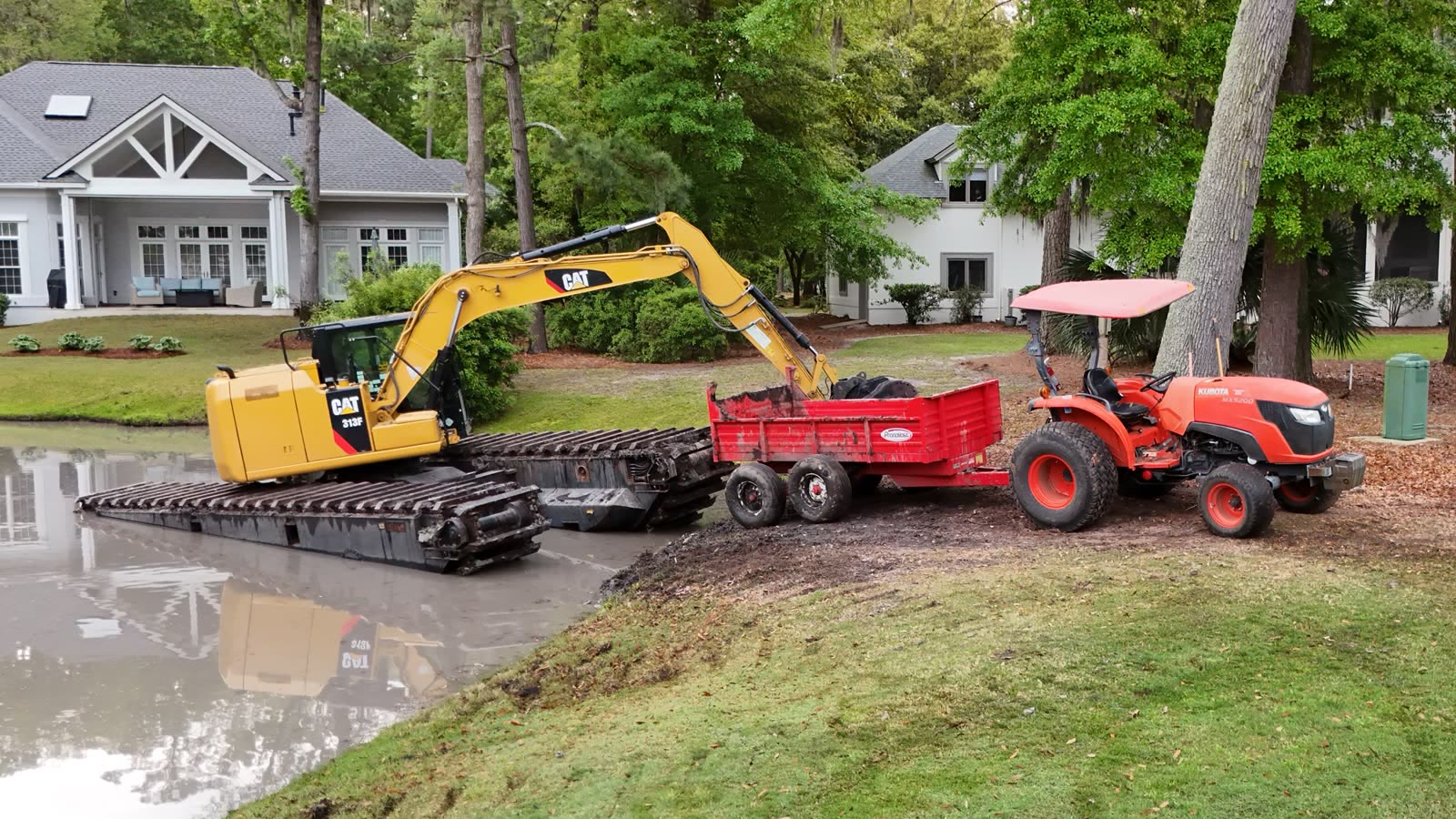 Three Kubota turf tractors used for turf-safe grounds and landscaped-site work